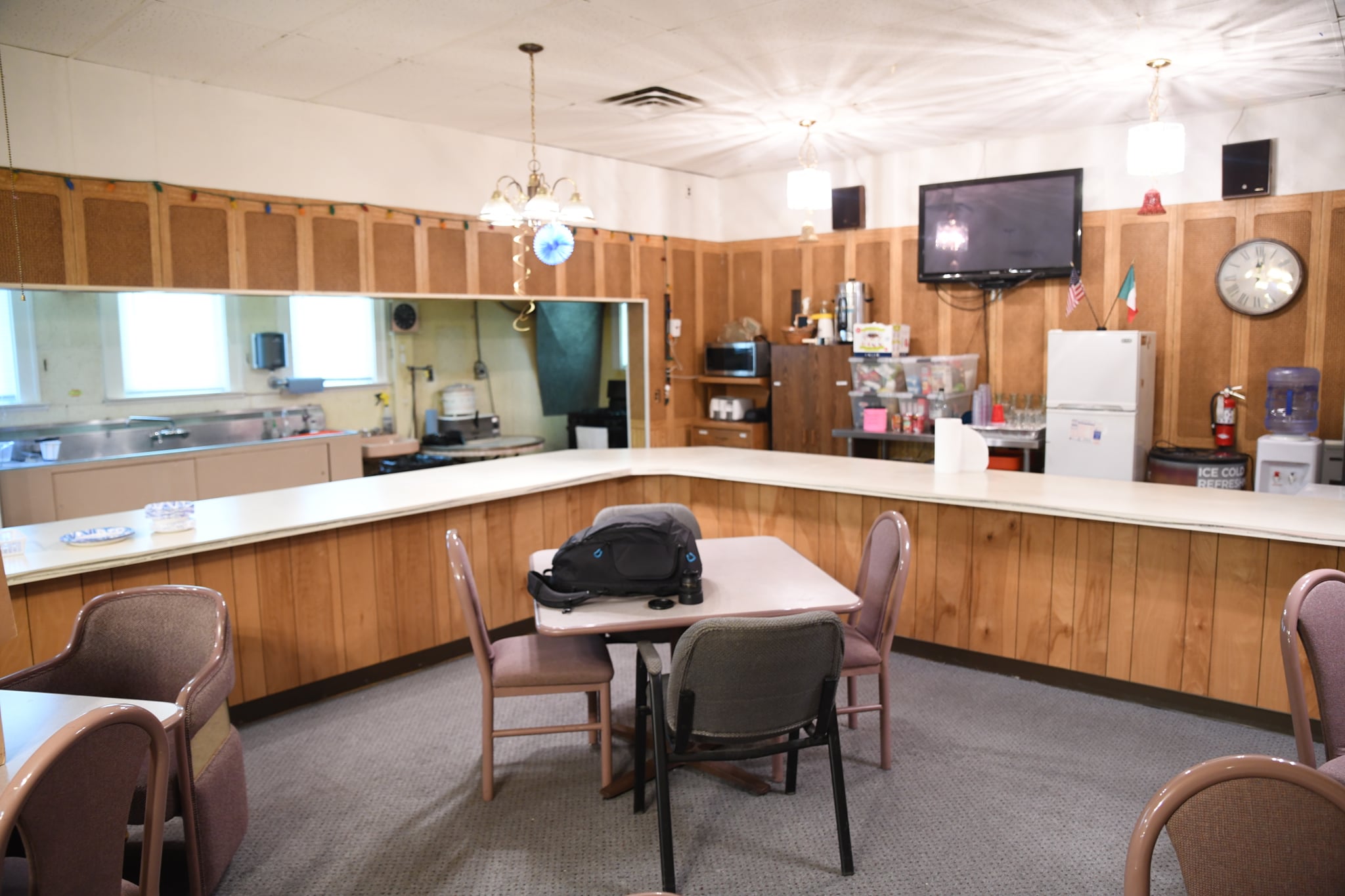 Hall interior with bar area and TV